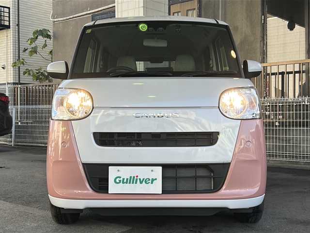 ダイハツ ムーヴ キャンバス ストライプス X 大分県 2023(令5)年 1.5万km シャイニングホワイトパール/アプリコットピンクメタリック ワンオーナー /9インチ純正SDナビ /フルセグTV /CD/DVD再生機能/バックカメラ /両側パワースライドドア /禁煙　/クリアランスソナー /2トーン /前方純正ドライブレコーダー /電動格納ミラー　/スマートキー/Wエアバッグ/オートライト