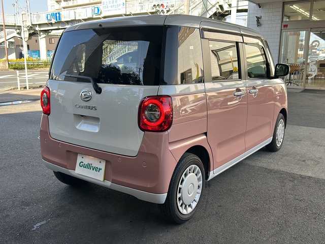 ダイハツ ムーヴ キャンバス ストライプス X 大分県 2023(令5)年 1.5万km シャイニングホワイトパール/アプリコットピンクメタリック ワンオーナー /9インチ純正SDナビ /フルセグTV /CD/DVD再生機能/バックカメラ /両側パワースライドドア /禁煙　/クリアランスソナー /2トーン /前方純正ドライブレコーダー /電動格納ミラー　/スマートキー/Wエアバッグ/オートライト