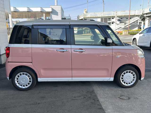 ダイハツ ムーヴ キャンバス ストライプス X 大分県 2023(令5)年 1.5万km シャイニングホワイトパール/アプリコットピンクメタリック ワンオーナー /9インチ純正SDナビ /フルセグTV /CD/DVD再生機能/バックカメラ /両側パワースライドドア /禁煙　/クリアランスソナー /2トーン /前方純正ドライブレコーダー /電動格納ミラー　/スマートキー/Wエアバッグ/オートライト