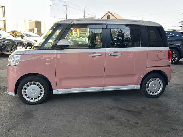 ダイハツ ムーヴ キャンバス ストライプス X 大分県 2023(令5)年 1.5万km シャイニングホワイトパール/アプリコットピンクメタリック ワンオーナー /9インチ純正SDナビ /フルセグTV /CD/DVD再生機能/バックカメラ /両側パワースライドドア /禁煙　/クリアランスソナー /2トーン /前方純正ドライブレコーダー /電動格納ミラー　/スマートキー/Wエアバッグ/オートライト