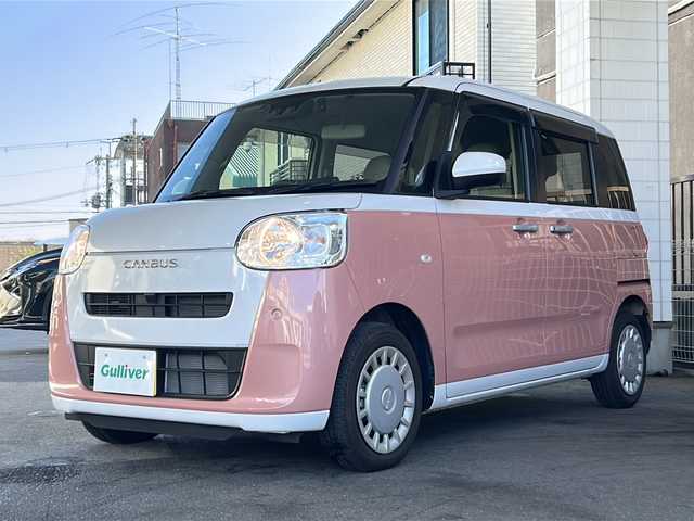 ダイハツ ムーヴ キャンバス ストライプス X 大分県 2023(令5)年 1.5万km シャイニングホワイトパール/アプリコットピンクメタリック ワンオーナー /9インチ純正SDナビ /フルセグTV /CD/DVD再生機能/バックカメラ /両側パワースライドドア /禁煙　/クリアランスソナー /2トーン /前方純正ドライブレコーダー /電動格納ミラー　/スマートキー/Wエアバッグ/オートライト