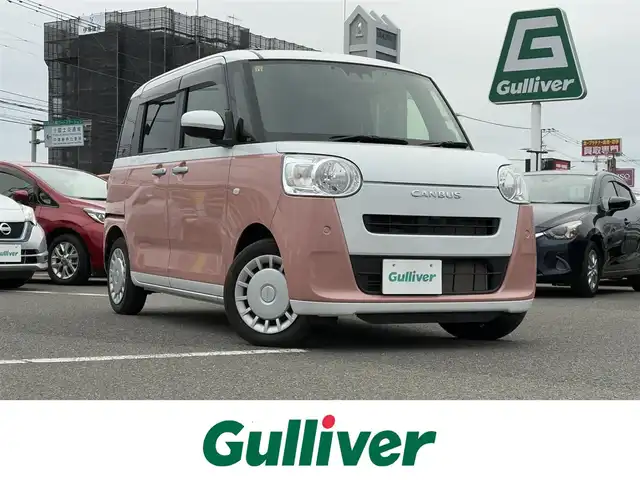 ダイハツ ムーヴ キャンバス ストライプス X 大分県 2023(令5)年 1.5万km シャイニングホワイトパール/アプリコットピンクメタリック ワンオーナー /9インチ純正SDナビ /フルセグTV /CD/DVD再生機能/バックカメラ /両側パワースライドドア /禁煙　/クリアランスソナー /2トーン /前方純正ドライブレコーダー /電動格納ミラー　/スマートキー/Wエアバッグ/オートライト