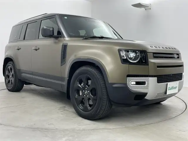 ランドローバー ランドローバー ディフェンダー 110S 愛知県 2023(令5)年 3.6万km ゴールド 純正サテンラップ（プロテクションフィルム）/OPエアサス/有償色ゴンドワナストーン/ブラックルーフ/ブラックエクステリアパック/純正ナビ（AppleCarPlay/AndroidAuto対応）/３６０度カメラ/ドラレコ/ＥＴＣ２．０/黒革シート/純正ＯＰ２０インチＡＷ/スマートキー×２