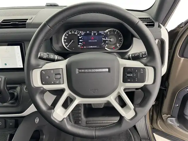 ランドローバー ランドローバー ディフェンダー 110S 愛知県 2023(令5)年 3.6万km ゴールド 純正サテンラップ（プロテクションフィルム）/OPエアサス/有償色ゴンドワナストーン/ブラックルーフ/ブラックエクステリアパック/純正ナビ（AppleCarPlay/AndroidAuto対応）/３６０度カメラ/ドラレコ/ＥＴＣ２．０/黒革シート/純正ＯＰ２０インチＡＷ/スマートキー×２