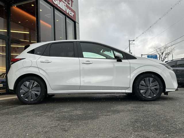 日産 ノート X 大阪府 2023(令5)年 0.8万km ピュアホワイトパール 純正ナビ/ETC/バックカメラ/電動パーキングブレーキ/前後ドライブレコーダー/オートエアコン/オートライト/ステアリングスイッチ/コーナーセンサー/スマートキー/USB接続端子/フロアマット欠品