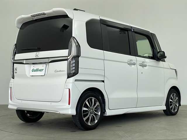 ホンダ Ｎ ＢＯＸ カスタム L 鹿児島県 2022(令4)年 1.9万km プラチナホワイトパール 純正9インチナビ/（CD/DVD/BT/フルセグTV）/レーダークルーズコントロール/電動パーキングブレーキ/オートホールド機能/ホンダセンシング/コーナーセンサ―/オートライト/オートハイビーム/シートヒーター/ベンチシート/ルーフコンソール/チップアップシート