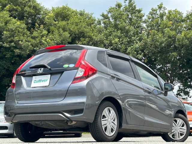 ホンダ フィット 13G L ホンダセンシング 東京都 2019(令1)年 2.5万km シャイニンググレーM ワンオーナー/Gathers純正7インチSDナビ（VXM-205Ci）/・Bluetoothオーディオ/USBオーディオ/iPod/バックカメラ/Honda SENSING/・アダプティブクルーズコントロール/純正ドライブレコーダー/ビルトインETC/取扱説明書/保証書/スペアキー1本