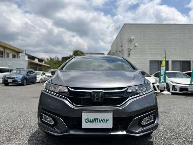ホンダ フィット 13G L ホンダセンシング 東京都 2019(令1)年 2.5万km シャイニンググレーM ワンオーナー/Gathers純正7インチSDナビ（VXM-205Ci）/・Bluetoothオーディオ/USBオーディオ/iPod/バックカメラ/Honda SENSING/・アダプティブクルーズコントロール/純正ドライブレコーダー/ビルトインETC/取扱説明書/保証書/スペアキー1本