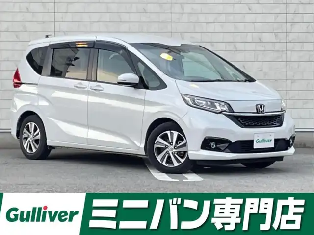 ホンダ フリード G ホンダセンシング 福岡県 2021(令3)年 2.8万km プラチナホワイトパール 純正7型SDナビ(フルセグTV/CD/DVD/BT)バックモニタホンダセンシングレーダークルコン両側パワスラ前後ドラレコETCUSB純正LEDヘッドライト純正アルミホイール純正フロアマットスマートキープッシュスタート