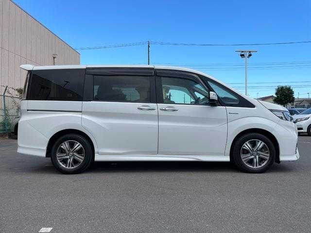 ホンダ ステップワゴン スパーダ eHEV G ホンダS 東京都 2020(令2)年 6.7万km プラチナホワイトパール 純正10型ナビ　/バックモニター　/衝突軽減ブレーキ　/路外逸脱抑制機能　/車線維持支援システム　/アダプティブクルーズコントロール　/両側パワースライドドア　/ETC　/ステアリングスイッチ　/スマートキー　/ECONモード
