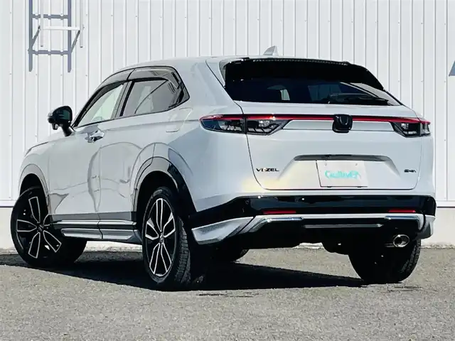 ホンダ ヴェゼル ハイブリッド e:HEV Z 熊本県 2022(令4)年 5.3万km プレミアムサンライトホワイトパール 純正ナビ/・AM/FM/USB/BT/・AppleCarPlay/AndroidAuto/・フルセグTV/バックカメラ/路外逸脱抑制機能/ブラインドスポットインフォメーション/踏み間違い衝突軽減システム/衝突軽減ブレーキ/オートマチックハイビーム/アダプティブクルーズコントロール/前後コーナーセンサー/革巻きステアリング/・ステアリングヒーター/・ステアリングリモコン/・パドルシフト/ハーフレザーシート/・D/N席シートヒーター/オートライト/・LEDライト/・フォグランプ/置くだけ充電/前後ドライブレコーダー/ETC2.0/電動格納ミラー/・ウィンカーミラー/電動サイドブレーキ/・ホールドボタン/ドアバイザー/トノカバー/純正フロアマット/純正アルミホイール/スマートキー/・スペアキー