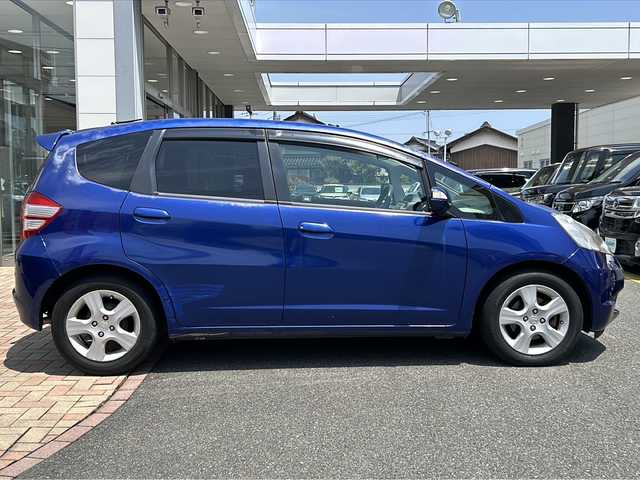 ホンダ フィット スポーティエディション 鳥取県 2010(平22)年 4.5万km ディープサファイアブルーパール ○純正ナビ/○電動格納ミラー/○ETC/○ワンセグ/○バックカメラ/○スタッドレスタイヤ4本積込
