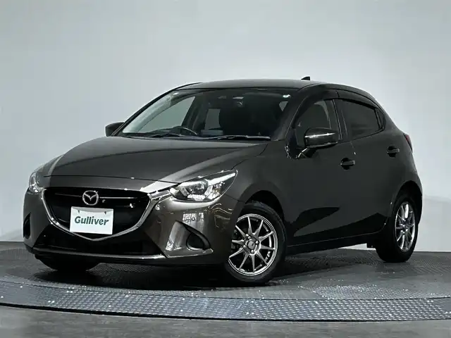 マツダ デミオ 15Sツーリング 愛媛県 2019(令1)年 4.2万km チタニウムフラッシュマイカ 純正メモリナビ/(AM/FM/CD/DVD/Bluetooth/フルセグ)/全周囲/バックカメラ/ヘッドアップディスプレイ/衝突被害軽減ブレーキ/ブラインドスポットモニター/レーンキープアシスト/オートマチックハイビーム/オートライト/アイドリングストップ/ウィンカーミラー/プッシュスタート/ETC