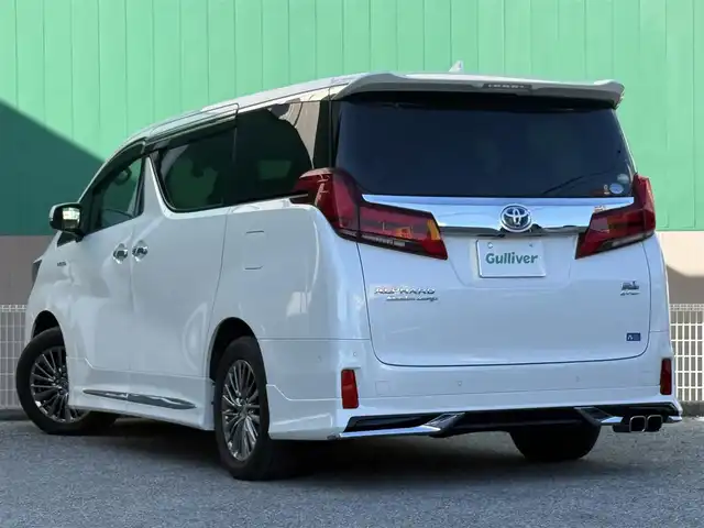 トヨタ アルファードハイブリット エグゼクティブ ラウンジ S 千葉県 2020(令2)年 5.6万km ホワイトパールクリスタルシャイン モデリスタフルエアロ/ツインムーンルーフ/純正メモリーナビ/フルセグ/CD/DVD/BT/USB/JBLプレミアムサウンド/パノラミックビューモニター/リヤエンターテイメントシステム/後席用フリップダウンモニター/パワーバックドア/両側パワースライドドア/デジタルインナーミラー/トヨタセーフティセンス/レーダークルーズコントロール/プリクラッシュセーフティ/レーンキープアシスト/レザーシート/1～2列目パワーシート/シートヒーター/ベンチレーション/ドライブレコーダー/ETC2.0/ステアリングヒーター/オートハイビーム/LEDヘッドライト/フォグランプ/スマートキー×2