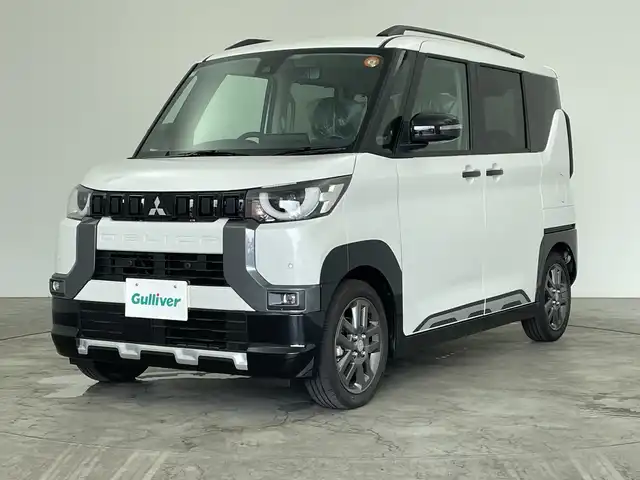 三菱 デリカミニ T プレミアム 三重県 2025(令7)年 0.1千km 白Ⅱ /届出済未使用車//純正ディスプレイオーディオ//AppleCarPray/AndroidAuto/iPod/Bluetooth/AM/FM/USB//前席シートヒーター//ステアリングヒーター//デジタルインナーミラー//レーダークルーズコントロール//ハンズフリースライドドア//パドルシフト//両側パワースライドドア//電動パーキング//純正15インチAW
