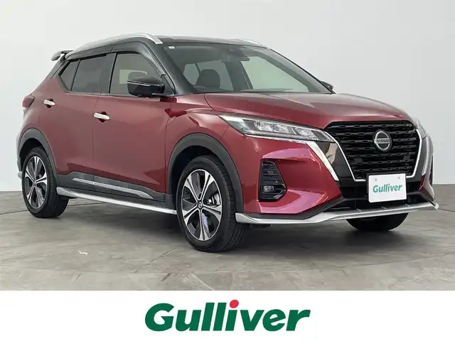 日産 キックス X 大分県 2021(令3)年 2.5万km ラディアントレッド/ピュアブラック 2トーン シルバースタイルパッケージ/・フロントアンダープロテクター/・サイドシルプロテクター/・リアアンダープロテクター/ルーフスポイラー/アラウンドビューモニター/デジタルインナーミラー /ナビ連動ドライブレコーダー（前方）/純正9型ナビ/【フルセグTV、DVD再生可、BT対応、USB】/TVキャンセラー（スイッチタイプ）/ステアリングスイッチ/ETC/ハーフレザーシート/・前席シートヒーター/電動パーキング/オートホールド機能/ステアリングヒーター/横滑り防止装置/電動格納ミラー/純正フロアマット/オートライト/LEDヘッドライト/フォグランプ/コーナーセンサー/純正17インチアルミホイール/保証書、取説