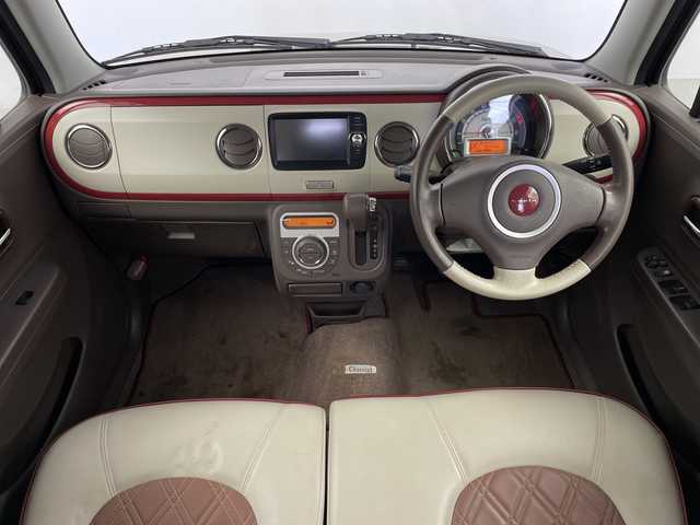 スズキ ラパン ショコラ X 鹿児島県 2014(平26)年 6.5万km シャンパンピンクPM 純正ナビ/(BT/AM/FM/ワンセグTV)/前方ドライブレコーダー/バックカメラ/レザーシート/アイドリングストップ/革巻きステアリング/ウィンカーミラー/ベンチシート/純正フロアマット/オートライト