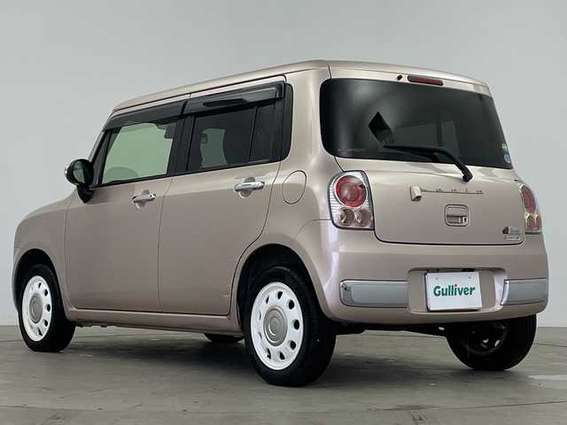 スズキ ラパン ショコラ X 鹿児島県 2014(平26)年 6.5万km シャンパンピンクPM 純正ナビ/(BT/AM/FM/ワンセグTV)/前方ドライブレコーダー/バックカメラ/レザーシート/アイドリングストップ/革巻きステアリング/ウィンカーミラー/ベンチシート/純正フロアマット/オートライト