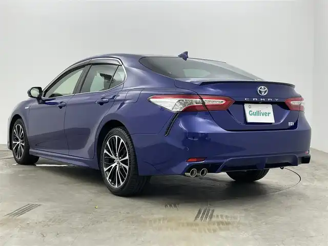 トヨタ カムリ WSレザーパッケージ 岡山県 2019(令1)年 1.7万km ダークブルーマイカM ワンオーナー	/JBLプレミアムサウンドシステム/純正8インチディスプレイオーディオ	/【ナビ/フルセグ/Bluetooth】	/バックカメラ/追従型クルーズコントロール	/オートハイビーム	/LEDヘッドライト（AUTO機能付き）	/ビルトインETC	/前席シートヒーター/前席パワーシート	/運転席パワーシート/パワーバックドア	/衝突軽減ブレーキシステム	/車線逸脱防止システム	/横滑り防止装置	/ブラインドスポットモニター/踏み間違い防止/社外ドライブレコーダー（前後）	/純正18インチアルミ	/コーナーセンサー（前後）	/純正フロアマット	/ステアリングスイッチ/ヘッドアップディスプレイ/シートリフター/ウィンカーミラー/ドアバイザー		/プッシュスタート	/スマートキー×2	/エンジンスターター