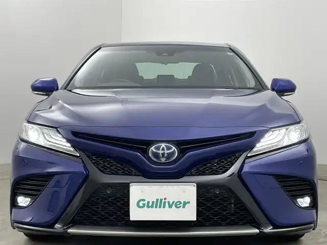 トヨタ カムリ WSレザーパッケージ 岡山県 2019(令1)年 1.7万km ダークブルーマイカM ワンオーナー	/JBLプレミアムサウンドシステム/純正8インチディスプレイオーディオ	/【ナビ/フルセグ/Bluetooth】	/バックカメラ/追従型クルーズコントロール	/オートハイビーム	/LEDヘッドライト（AUTO機能付き）	/ビルトインETC	/前席シートヒーター/前席パワーシート	/運転席パワーシート/パワーバックドア	/衝突軽減ブレーキシステム	/車線逸脱防止システム	/横滑り防止装置	/ブラインドスポットモニター/踏み間違い防止/社外ドライブレコーダー（前後）	/純正18インチアルミ	/コーナーセンサー（前後）	/純正フロアマット	/ステアリングスイッチ/ヘッドアップディスプレイ/シートリフター/ウィンカーミラー/ドアバイザー		/プッシュスタート	/スマートキー×2	/エンジンスターター