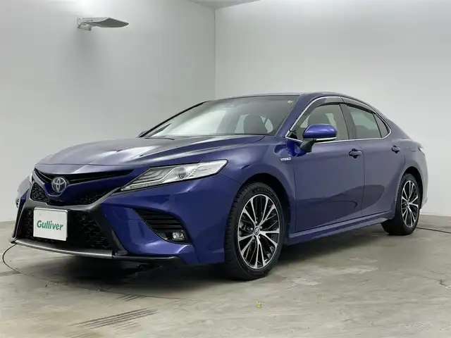 トヨタ カムリ WSレザーパッケージ 岡山県 2019(令1)年 1.7万km ダークブルーマイカM ワンオーナー	/JBLプレミアムサウンドシステム/純正8インチディスプレイオーディオ	/【ナビ/フルセグ/Bluetooth】	/バックカメラ/追従型クルーズコントロール	/オートハイビーム	/LEDヘッドライト（AUTO機能付き）	/ビルトインETC	/前席シートヒーター/前席パワーシート	/運転席パワーシート/パワーバックドア	/衝突軽減ブレーキシステム	/車線逸脱防止システム	/横滑り防止装置	/ブラインドスポットモニター/踏み間違い防止/社外ドライブレコーダー（前後）	/純正18インチアルミ	/コーナーセンサー（前後）	/純正フロアマット	/ステアリングスイッチ/ヘッドアップディスプレイ/シートリフター/ウィンカーミラー/ドアバイザー		/プッシュスタート	/スマートキー×2	/エンジンスターター