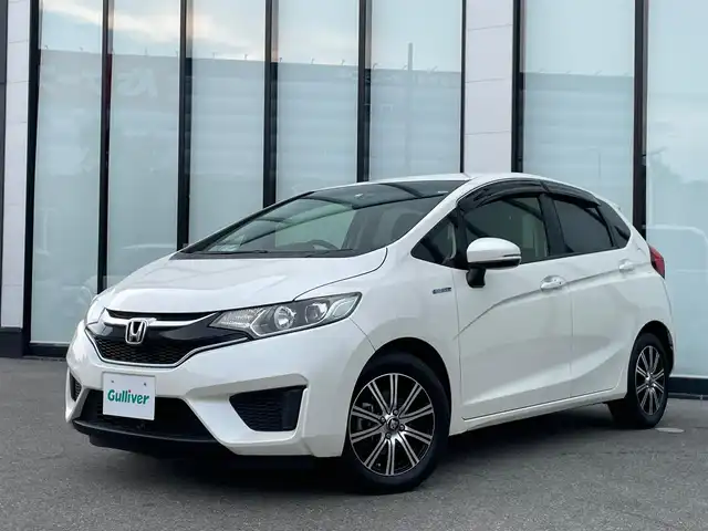 ホンダ フィット ハイブリット Lパッケージ 大阪府 2016(平28)年 4.7万km プレミアムホワイトパールⅡ 社外ナビ　/    TV/CD/DVD/Bluetooth/バックモニター　/あんしんパッケージ/PRAUZER15インチホイール　/クルーズコントロール　/ステアリングスイッチ　/アイドリングストップ　/前方ドライブレコーダー　/純正フロアマット　/プッシュスタート　　/ビルトインＥＴＣ　/ＬＥＤ/禁煙車