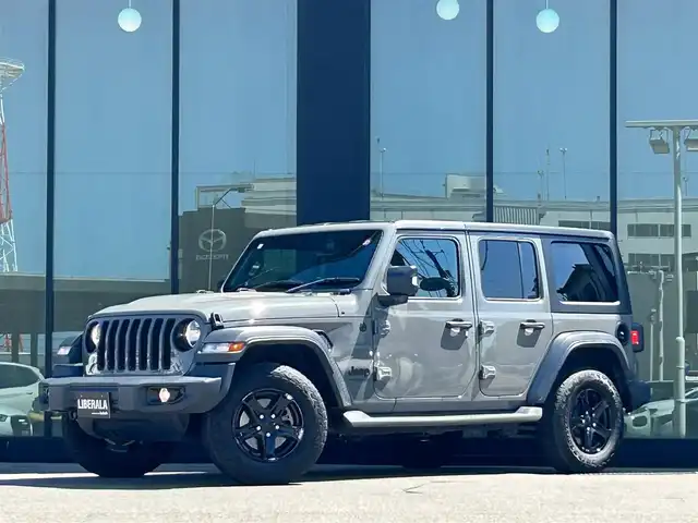 クライスラー・ジープ ジープ ラングラー アンリミテッド スポーツ アルティテュード 石川県 2020(令2)年 4.7万km グレー 4WD/純正ナビディスプレイオーディオナビ/AppleCarPlay/クリアランスソナー/トランスファーレバー/バックカメラ/サイドカメラ/アダプティブクルーズコントロール/ドライブレコーダー/ETC/ABS/横滑り防止装置/盗難防止装置/衝突被害軽減ブレーキ
