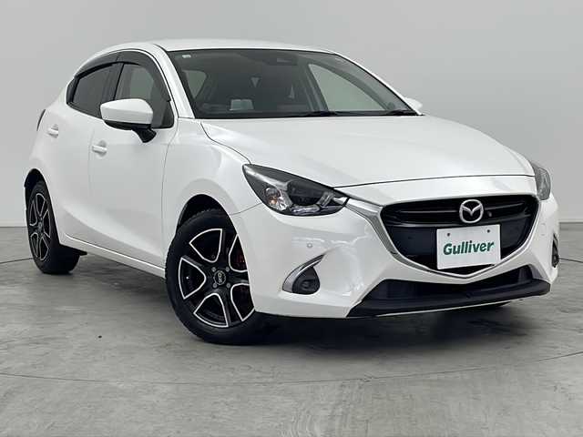 マツダ デミオ 15Sツーリング 三重県 2018(平30)年 5.8万km スノーフレイクホワイトパールマイカ 禁煙車/メーカーＯＰSDナビ/・Bluetooth・フルセグ・CD/DVD・SD・AUX・USB/３６０°ビューモニター/衝突被害軽減ブレーキ/車線逸脱警報システム/パーキングセンサー/ＢＳＭ/オートライト/オートマチックハイビーム/HUD/パドルシフト/前席シートヒーター/ビルドインＥＴＣ
