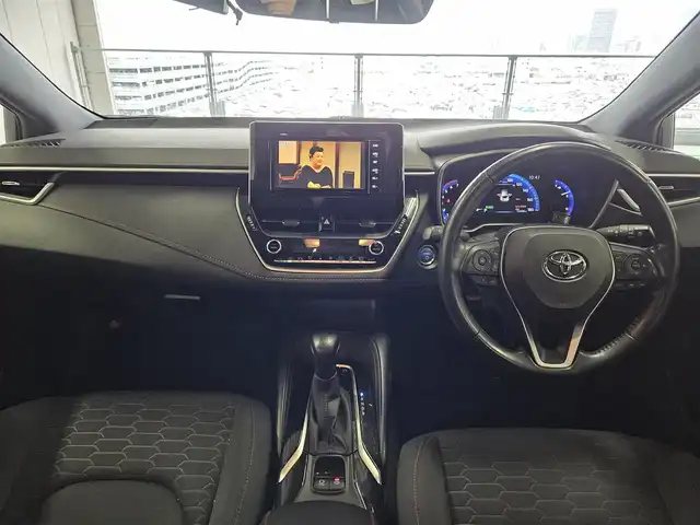 トヨタ カローラ スポーツ ハイブリッドG Z 香川県 2019(令1)年 5.3万km ホワイトパールクリスタルシャイン 〇純正ナビ/〇フルセグTV/〇セーフティセンス/・プリクラッシュセーフティシステム/・レーントレーシングアシスト/・レーダークルーズコントロール/・オートマチックハイビーム/・ロードサインアシスト/〇ドライブモードセレクト/〇LEDヘッドランプ	/〇オートライト	/〇LEDフロントフォグランプ	/〇純正18インチアルミ	/〇革巻きステアリング	/〇左右独立温度調整オートエアコン/〇レッドステッチ入ブラックファブリックシート/〇スポーツシート（前席）/〇ビルトインETC/〇ドライブレコーダー/〇スマートエントリー