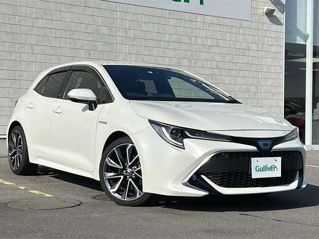 トヨタ カローラ スポーツ ハイブリッドG Z 香川県 2019(令1)年 5.3万km ホワイトパールクリスタルシャイン 〇純正ナビ/〇フルセグTV/〇セーフティセンス/・プリクラッシュセーフティシステム/・レーントレーシングアシスト/・レーダークルーズコントロール/・オートマチックハイビーム/・ロードサインアシスト/〇ドライブモードセレクト/〇LEDヘッドランプ	/〇オートライト	/〇LEDフロントフォグランプ	/〇純正18インチアルミ	/〇革巻きステアリング	/〇左右独立温度調整オートエアコン/〇レッドステッチ入ブラックファブリックシート/〇スポーツシート（前席）/〇ビルトインETC/〇ドライブレコーダー/〇スマートエントリー
