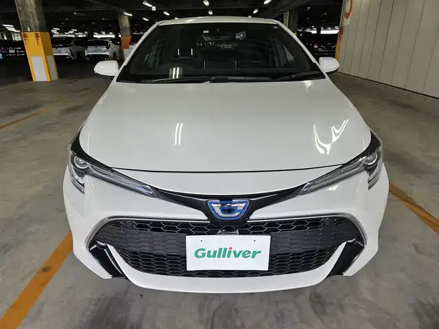 トヨタ カローラ スポーツ ハイブリッドG Z 香川県 2019(令1)年 5.3万km ホワイトパールクリスタルシャイン 〇純正ナビ/〇フルセグTV/〇セーフティセンス/・プリクラッシュセーフティシステム/・レーントレーシングアシスト/・レーダークルーズコントロール/・オートマチックハイビーム/・ロードサインアシスト/〇ドライブモードセレクト/〇LEDヘッドランプ	/〇オートライト	/〇LEDフロントフォグランプ	/〇純正18インチアルミ	/〇革巻きステアリング	/〇左右独立温度調整オートエアコン/〇レッドステッチ入ブラックファブリックシート/〇スポーツシート（前席）/〇ビルトインETC/〇ドライブレコーダー/〇スマートエントリー