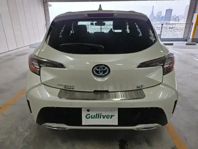 トヨタ カローラ スポーツ ハイブリッドG Z 香川県 2019(令1)年 5.3万km ホワイトパールクリスタルシャイン 〇純正ナビ/〇フルセグTV/〇セーフティセンス/・プリクラッシュセーフティシステム/・レーントレーシングアシスト/・レーダークルーズコントロール/・オートマチックハイビーム/・ロードサインアシスト/〇ドライブモードセレクト/〇LEDヘッドランプ	/〇オートライト	/〇LEDフロントフォグランプ	/〇純正18インチアルミ	/〇革巻きステアリング	/〇左右独立温度調整オートエアコン/〇レッドステッチ入ブラックファブリックシート/〇スポーツシート（前席）/〇ビルトインETC/〇ドライブレコーダー/〇スマートエントリー