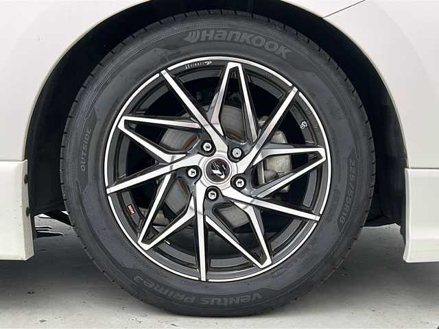 日産 エルグランド 250ハイウェイスターS 宮城県 2016(平28)年 5万km ブリリアントホワイトパール 禁煙車/ローダウン（社外足回り）/純正9インチナビ/・CD.DVD.SD.BT/フルセグTV/バックモニター/両側パワースライドドア/ハーフレザーシート/オットマン/ビルトインETC/純正ドライブレコーダー/クルーズコントロール/横滑り防止装置/ウッドコンビステアリングホイール/ステアリングスイッチ/プッシュスタート/スマートキー/社外18インチアルミホイール/純正フロアマット/後席ロールサンシェード