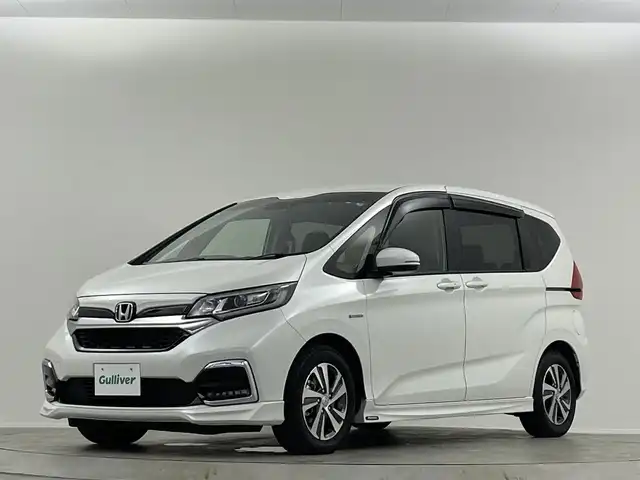 ホンダ フリード ハイブリット G ホンダセンシング 埼玉県 2021(令3)年 2.9万km プラチナホワイトパール 禁煙車　純正９型ナビ　シートヒーター　両側電動パワースライドドア　バックカメラ　　ドライブレコーダー　ＥＴＣ２．０　レーダークルーズコントロール　フルセグＴＶ　寒冷地仕様　ＬＥＤヘッドライト　１００Ｖ電源