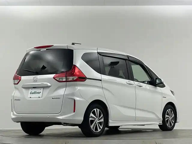 ホンダ フリード ハイブリット G ホンダセンシング 埼玉県 2021(令3)年 2.9万km プラチナホワイトパール 禁煙車　純正９型ナビ　シートヒーター　両側電動パワースライドドア　バックカメラ　　ドライブレコーダー　ＥＴＣ２．０　レーダークルーズコントロール　フルセグＴＶ　寒冷地仕様　ＬＥＤヘッドライト　１００Ｖ電源