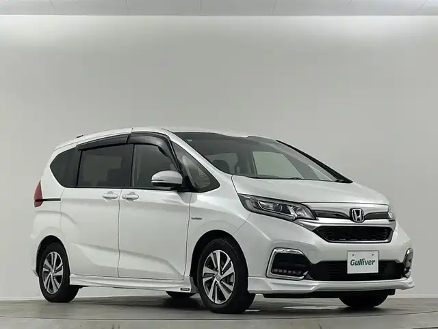 ホンダ フリード ハイブリット G ホンダセンシング 埼玉県 2021(令3)年 2.9万km プラチナホワイトパール 禁煙車　純正９型ナビ　シートヒーター　両側電動パワースライドドア　バックカメラ　　ドライブレコーダー　ＥＴＣ２．０　レーダークルーズコントロール　フルセグＴＶ　寒冷地仕様　ＬＥＤヘッドライト　１００Ｖ電源
