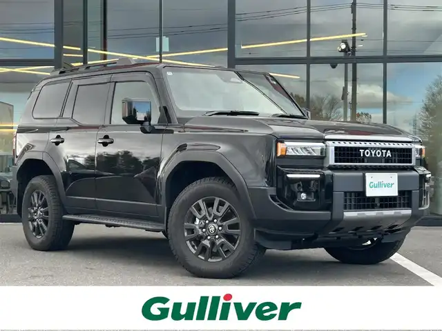 トヨタ ランドクルーザー ２５０ VX 栃木県 2024(令6)年 0.3万km ブラック ワンオーナー/ムーンルーフ/トヨタセーフティセンス/ディスプレイオーディオプラス/フルセグTV/Bluetooth/USB/HDMI/MiraCast/JBLプレミアムサウンドシステム/床下透過表示機能付パノラミックビューモニター/周辺車両接近時サポート付ブラインドスポットモニター/デジタルインナーミラー/ETC2.0/黒革シート/パワーシート/シートヒーター/エアシート/パワーバックドア/パーキングサポートブレーキ/クリアランスソナー/レーダークルーズコントロール/LEDヘッドライト/フロント/リアフォグ/ステアリングヒーター/リモコン/nanoeX左右後席独立オートエアコン/保証書/取説
