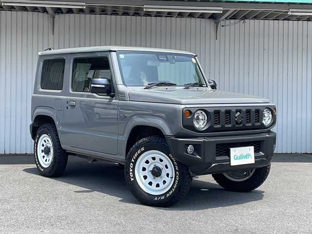 スズキ ジムニー XC 長野県 2022(令4)年 0.5万km ミディアムグレー ４WD/スズキセーフティサポート/純正メモリナビフルセグTV/ドライブレコーダー/ETC/シートヒーター/純正16インチアルミ/社外マフラー/ワンオーナー/保証書・取説/スペアキー