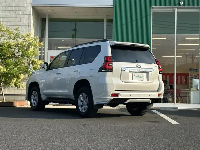 トヨタ ランドクルーザー プラド TX Lパッケージ 岡山県 2023(令5)年 2.6万km ホワイトパールクリスタルシャイン ALPINE9インチナビ　X9NXL/フルセグTV、CD、DVD、AM、FM/Bluetooth/バックカメラ、サイドカメラ/モデリスタエアロ/ベージュレザーシート/サンルーフ/レーンディパーチャーアラート/レーダークルーズコントロール/プリクラッシュセーフティ/ロードサインアシスト/先行車発進お知らせ機能/前後コーナーセンサー/前席シートヒーター/前席ベンチレーション/前席パワーシート/ルーフレール