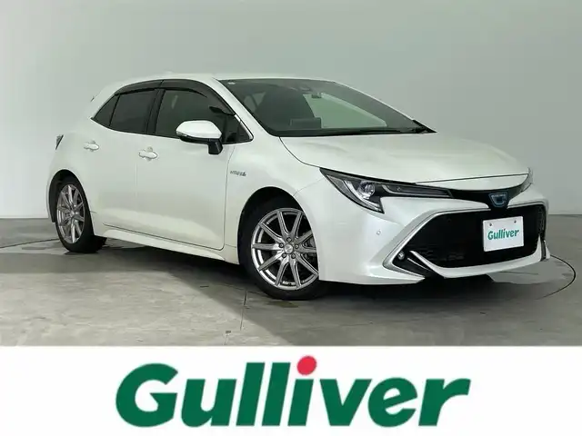 トヨタ カローラ スポーツ ハイブリッドG Z 富山県 2020(令2)年 4.9万km ホワイトパールクリスタルシャイン 純正9型ディスプレイオーディオ/（AM/FM/BT/USB/フルセグ）/バックカメラ/ドライブレコーダー/ETC/衝突被害軽減システム/レーダークルーズコントロール/レーンキープアシスト/コーナーセンサー/横滑り防止装置/アイドリングストップ/オートLEDライト/オートマチックハイビーム/フォグライト/純正フロアマット/社外アルミホイール/革巻きステアリング/ステアリングスイッチ/純正ホイール付夏タイヤ有/スマートキー/スペアキー/純正エンジンスターター有