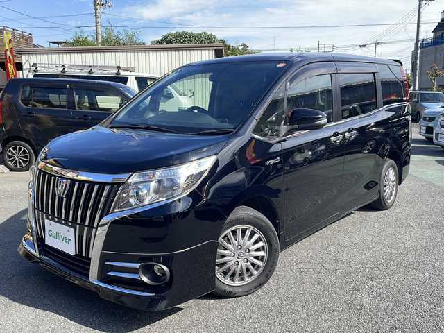 トヨタ エスクァイア ハイブリッド Gi 埼玉県 2015(平27)年 9.7万km ブラック セーフティーセンス/フリップダウンモニター/純正SDナビ/　　Bluetooth/フルセグTV/DVD再生機能/バックカメラ/両側パワースライドドア/クルーズコントロール/LEDオートヘッドライト/レザーシート/運転席、助手席シートヒーター/純正15インチアルミホイール/ワイヤレス充電/アイドリングストップ/ETC