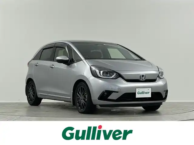 ホンダ フィット e:HEVリュクス 埼玉県 2020(令2)年 4.3万km ルナシルバーM メーカーOPナビ　バックカメラ　前後ドラレコ　レーダークルコン　レーンアシスト　コーナーセンサー　フルセグ　純正AWサマータイヤ車載　ハーフレザー　前席シートヒーター　スペアキー　ワイヤレス充電