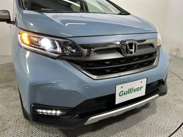 ホンダ フリード クロスター ホンダセンシング 大阪府 2021(令3)年 1.9万km シーグラスブルーパール 社外ナビ(フルセグ/DVD再生/Bluetooth) バックカメラ ETC 両側パワースライドドア ハーフレザー シートヒーター 衝突軽減 レーダークルコン レーンアシスト 前後ドラレコ ワンオーナー