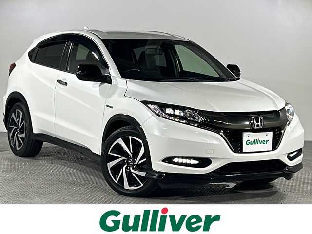 ホンダ ヴェゼル ハイブリッド RS ホンダセンシング 沖縄県 2016(平28)年 9.2万km ホワイトオーキッドパール 禁煙車/純正8インチナビ/【CD/DVD/フルセグTV/BT】/バックカメラ/ETC/ステアリングリモコン/レーダークルーズコントロール/パドルシフト/ハーフレザー/衝突被害軽減ブレーキ/レーンキープアシスト/横滑り防止装置/１８インチ純正アルミ/LEDヘッドライト/オートライト/スマートキー