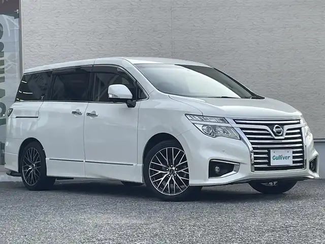 日産 エルグランド 250ハイウェイスター プレミアム 大阪府 2014(平26)年 8.8万km ブリリアントホワイトパール 純正HDDナビ/CD/DVD/フルセグTV/Bluetooth/USB/純正リアエンターテイメントシステム/・後席11インチワイドモニター/・後席リモコン/・ワイヤレスヘッドフォン2個/アラウンドビューモニター/ブラック革シート/パワーシート（前席）/運転席のみメモリー機能付き/シートヒーター（前席）/オットマン/ビルトインETC/両側パワースライドドア/クルーズコントロール/ドライブレコーダー（DRV-340)/AC100V/社外マフラー（柿本）/社外19インチAW/LEDヘッドランプ/フォグランプ/フロントソナー/バックソナー/革巻ステアリング/ステアリングスイッチ/プッシュスタート/スマートキー×２/取扱説明書/保証書