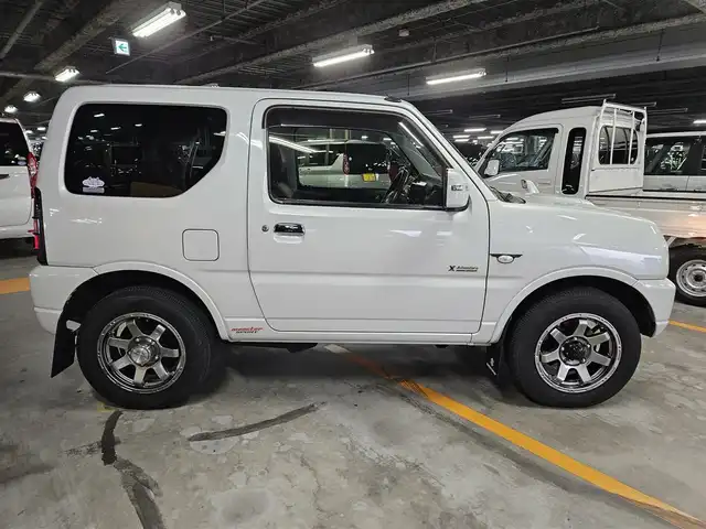 スズキ ジムニー クロスアドベンチャー 福岡県 2012(平24)年 7.5万km パールホワイト クラリオンナビ/フルセグTV/ETC/IC付ターボ/革巻きステアリング/合皮シート/前席シートヒーター/純正16インチアルミホイール/リモコンキー/禁煙車