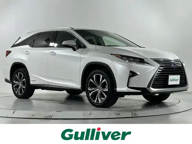 レクサス ＲＸ 450hL 佐賀県 2018(平30)年 3.6万km ソニッククォーツ ワンオーナー/純正12.3インチナビ/フルセグTV/CD/DVD/Bluetooth/全方位カメラ/サンルーフ/衝突被害軽減システム/レーダークルーズコントロール/レーンアシスト/ブラインドスポットモニター/先行車発進告知機能/ヘッドアップディスプレイ/クリアランスソナー/オートライト/オートマチックハイビーム/3眼LEDヘッドライト/LEDフォグライト/電子パーキング/ブレーキホールド/横滑り防止装置/ビルトインETC2.0/パワーバックドア/電動格納サードシート/運転席・助手席パワーシート/運転席・助手席シートヒーター/運転席・助手席エアシート/レザーシート/ステアリングヒーター/ISOFIX対応シート/純正フロアマット/純正20インチアルミホイール