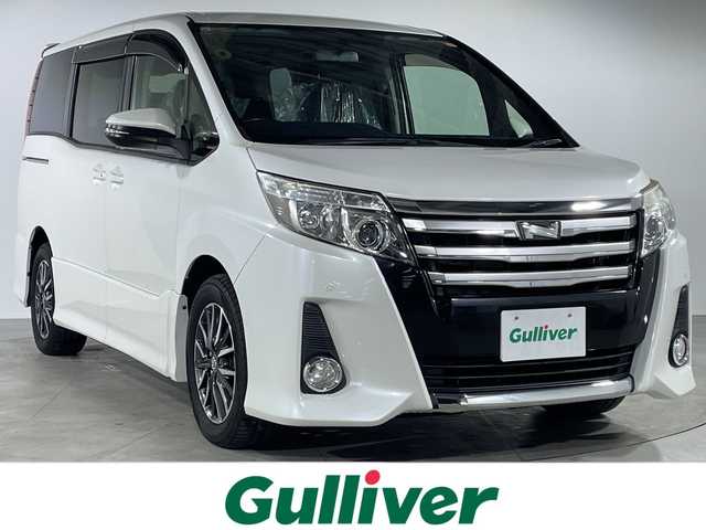 トヨタ ノア Si 福岡県 2014(平26)年 5.9万km ホワイトパールクリスタルシャイン 純正メモリナビ/両側パワースライドドア/3列シート/フルセグテレビ/Bluetooth接続/ウォークスルー/バックカメラ/アイドリングストップ/プッシュスタート/スマートキー/純正ETC/前方コーナーセンサー/CD/DVD再生/MT付きATモード/純正フロアマット