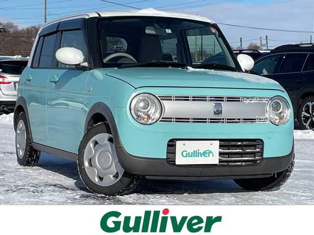 スズキ ラパン S 道央・札幌 2015(平27)年 13.5万km フレンチミントパールメタリック ４WD/社外メモリーナビ/AM/FM/CD/AUX/衝突被害軽減ブレーキ/横滑り防止装置/バックカメラ/ETC/アイドリングストップ/前席シートヒーター/革巻きステアリング/プッシュスタート/スマートキー/キセノンヘッドライト/オートライト/電動格納ミラー/ヒーテッドドアミラー/社外フロアマット/ドアバイザー/社外AW付夏タイヤ積込/155/65/R14/2025年/山6mm