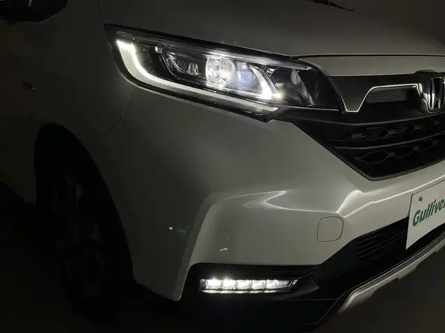 ホンダ フリード ハイブリット クロスター ホンダセンシング 群馬県 2022(令4)年 2.5万km プラチナホワイトパール 7インチナビ/・AM/FM/CD/DVD/USB/Bluetooth/フルセグTV/ホンダセンシング/・衝突軽減ブレーキ（CMBS）/・誤発進/誤後進抑制機能/・路外逸脱抑制機能/・渋滞追従機能付アダプティブクルーズコントロール（ACC）/・車線維持支援システム（LKAS）/・先行車発進お知らせ機能/・標識認識機能/バックカメラ/ハーフレザーシート/LEDライト/両側パワースライドドア/スマートキー/プッシュスタート